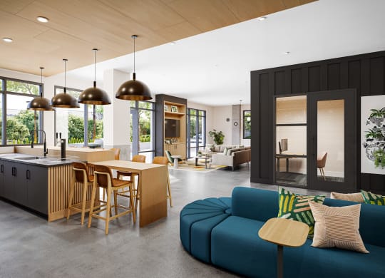 a kitchen and living room with a blue couch and a wooden table at Link Apartments® CYKEL Apartments, Charlotte , 28208