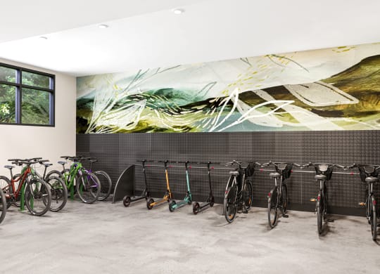 a row of bikes parked in front of a wall with a mural at Link Apartments® CYKEL Apartments, Charlotte , NC