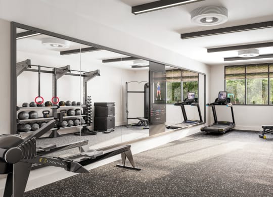 a workout room with weights machines and a window at Link Apartments® CYKEL Apartments, North Carolina, 28208