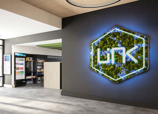 a sign on a wall in the lobby of a store at Link Apartments® CYKEL Apartments, Charlotte , North Carolina