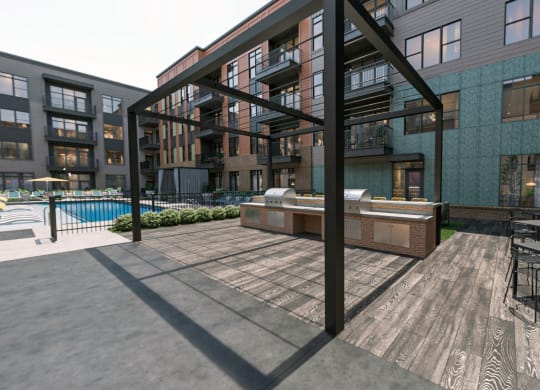 Gas grills at large pool courtyard at Link Apartments® Broad Ave near Kordova in Memphis, TN.
