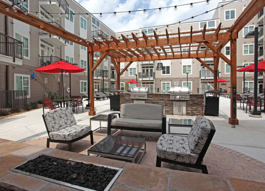 Outdoor Grill With Intimate Seating Area at Link Apartments® Brookstown, North Carolina, 27101