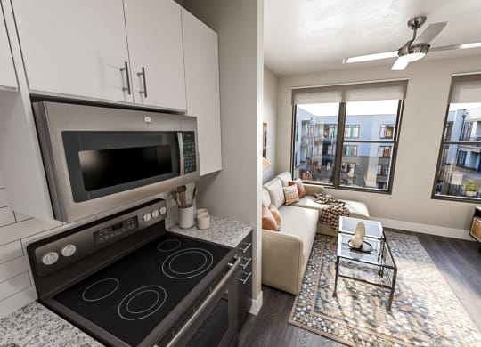 a kitchen and living room in a 555 waverly unit at Link Apartments NoDa 36th, Charlotte North Carolina