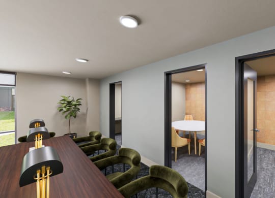 a meeting room with a table and chairs at Link Apartments NoDa 36th, Charlotte, 28206