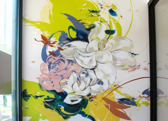 a large mural in the living room at Link Apartments® Canvas, Georgia