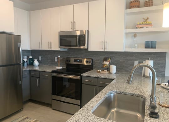 Spacious new kitchen with granite counter tops at Link Apartments® Mixson, North Charleston, SC, 29405
