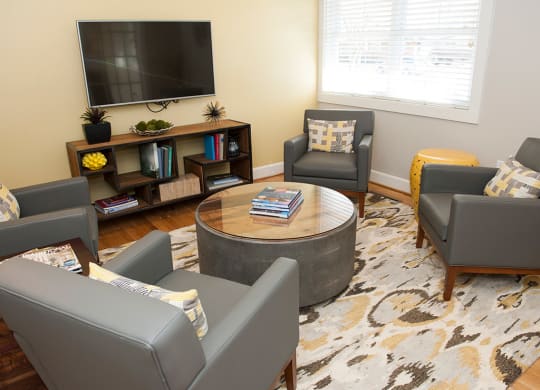 Living Area With TV at Glen Lennox Apartments, North Carolina, 27514