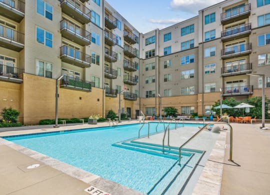 a swimming pool in front of an apartment building at Link Apartments Innovation Quarter, North Carolina