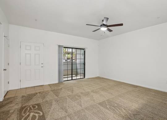 A room with a ceiling fan at Rome Park Villas, North Las Vegas
