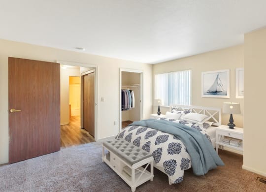 a bedroom with a bed and a closet