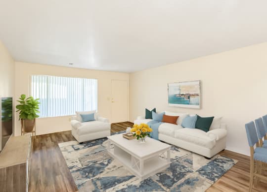 a living room with a white couch and a coffee table