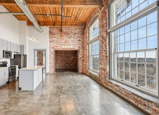 Spartanburg, SC with granite countertops, stone floors, stainless steel appliances and large windows.