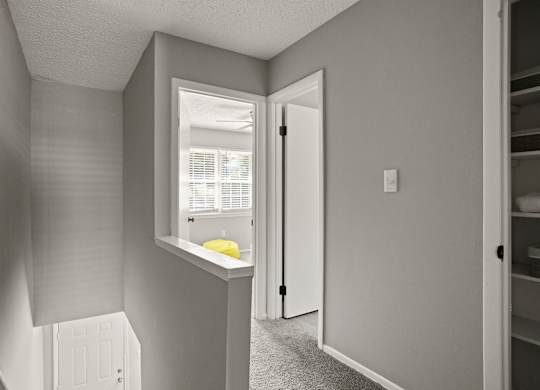 A small room with a window and a door.