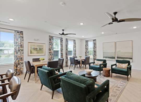 Ovata at Reedy Creek Senior Apartments in Charlotte NC community kitchen with modern appliances and dining room tables