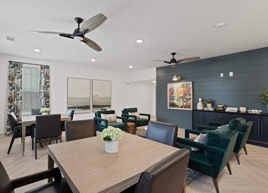 Ovata at Reedy Creek Senior Apartments in Charlotte NC community kitchen with modern appliances and dining room tables