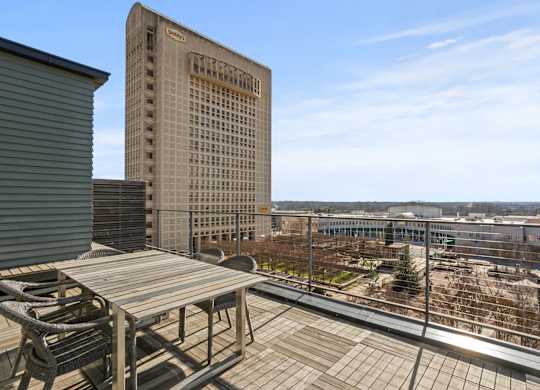 Upper floor terrace at Aug Smith on Main, facing downtown Spartanburg, a park, and the headquarters of Denny's.