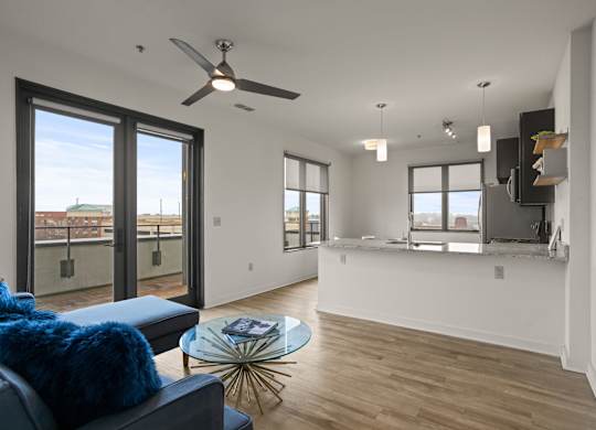 Aug Smith on Main living room and kitchen with couches and island