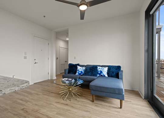 A living room at Aug Smith on Main from the perspective of the connected kitchen