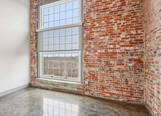 Unstaged living room in Converse Mill Lofts in Spartanburg, SC
