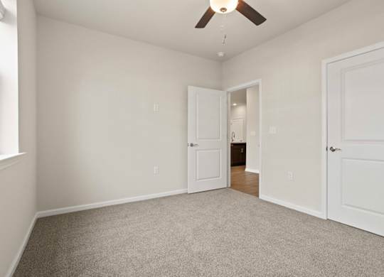 Grande at Geyser Falls Luxury Apartments Room with Grey Carpet and Ceiling Fan