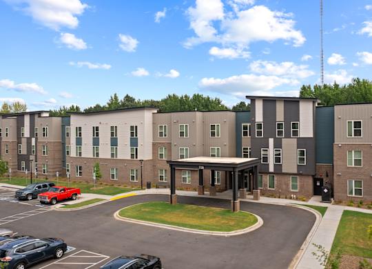 Ovata at Reedy Creek Senior Apartments in Charlotte NC Exterior view of entrance and covered entry drive