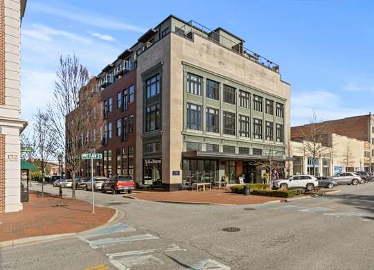 An exterior view of Aug Smith on Main on a street corner in downtown Spartanburg, SC.