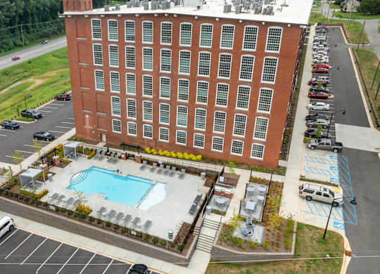 Aerial View of Converse Mill Lofts Apartments in Spartanburg SC, facing the pool