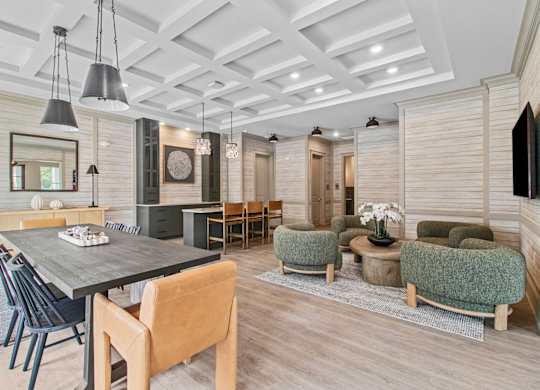 A modern dining room with a wooden table and chairs.