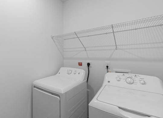 A laundry room with a washer and dryer.