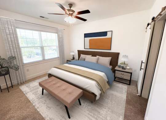 A bedroom with a bed, nightstand, and window.