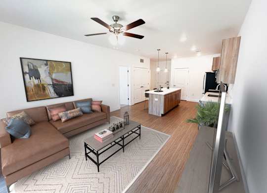 A living room with a brown couch and a coffee table.