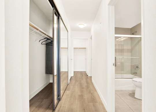 A white hallway with a toilet and a shower at Twelve One Ten Rochester, Los Angeles, CA
