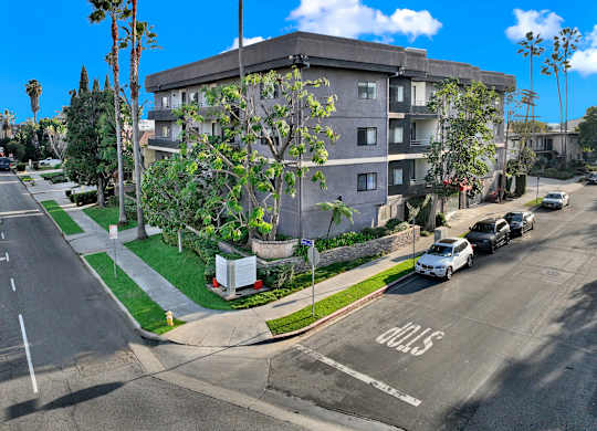 A street view of a residential area with cars parked on the side of the road at Twelve One Ten Rochester, Los Angeles, CA 90025