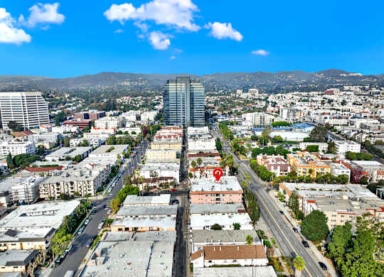 A cityscape with a red marker on a building at Twelve One Ten Rochester, Los Angeles, California