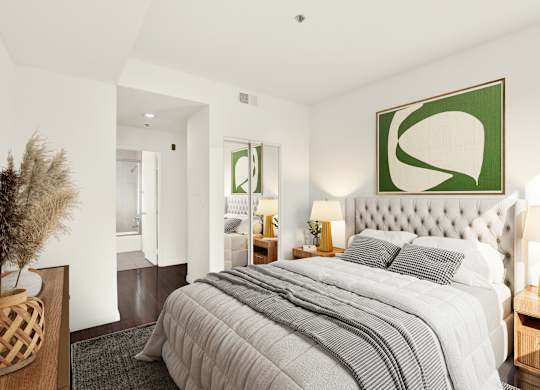 A bedroom with a large bed and a green abstract painting above it at Peach Tree Court, California