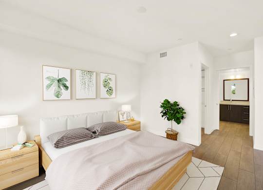 A bedroom with a bed, nightstand, and a plant at The Urbanpolitan, California