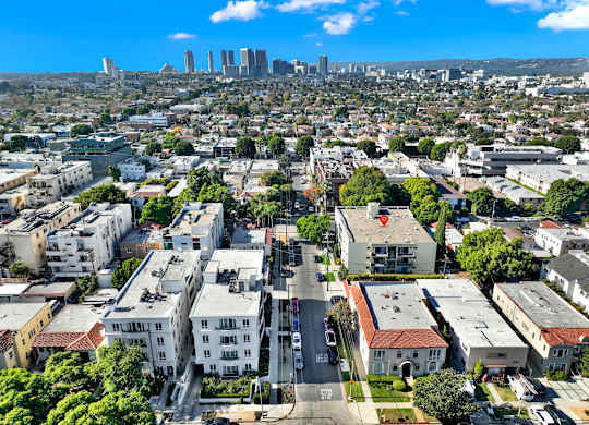A cityscape with buildings and a clear sky at Wooster Encore Apartments, Los Angeles, California
