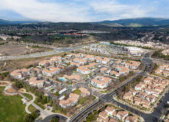 A bird's eye view of a residential area with houses and roads at Cornerstone at Gale Ranch Apartments, San Ramon