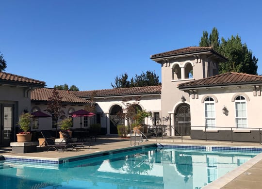 a house with a swimming pool in front of it  at Falcon Bridge at Gale Ranch, San Ramon, CA
