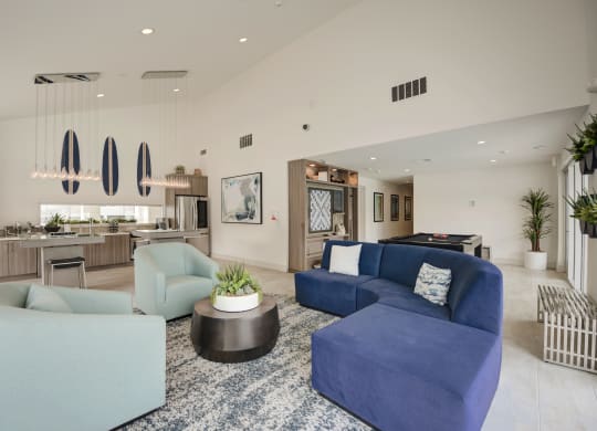 a living room filled with furniture and a large window  at Laguna Gardens Apts., Laguna Niguel, CA