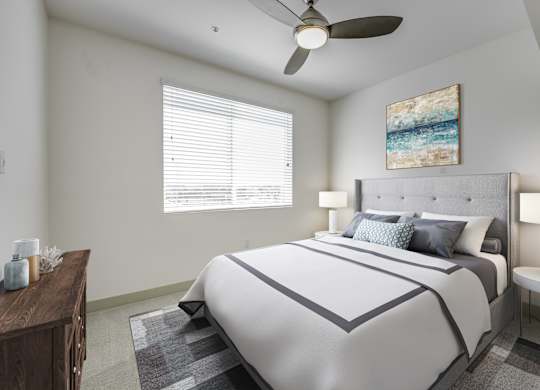 A bedroom with a large bed and a ceiling fan at Montecito at Carlsbad, Carlsbad, CA 92010