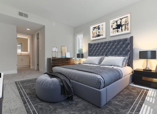 a bedroom with a bed and a dresser in a room  at Laguna Gardens Apts., California