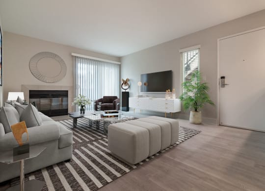 a living room with a fireplace and a tv on the wall  at Laguna Gardens Apts., California