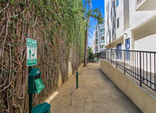 a walkway next to an apartment building  at Masselin Park West, California