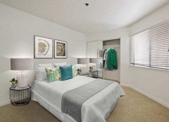 a bedroom with a large bed next to a window  at Masselin Park West, Los Angeles