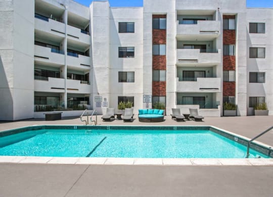 an image of a pool in front of an apartment building  at Masselin Park West, Los Angeles, CA
