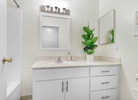 a bathroom with a sink and a mirror  at Sherway Villa, Reseda