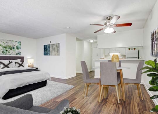 a bedroom with a bed and a ceiling fan and lamp  at Sherway Villa, California