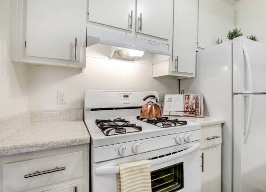 a kitchen with a stove top oven  at Sherway Villa, Reseda
