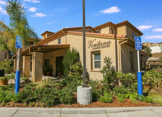 a building with a sign on the side of it at  Ventana Senior Apartments, Porter Ranch ,91326
